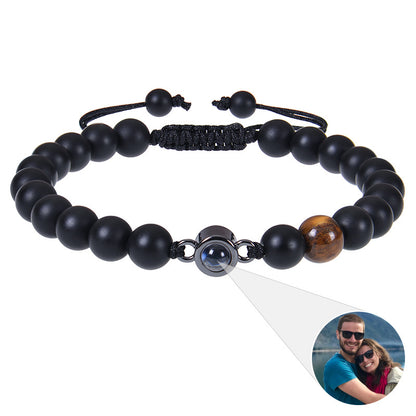 White turquoise custom photo projection bracelet by BackupMyFilesNow.com showcasing engraved design in 100 languages.