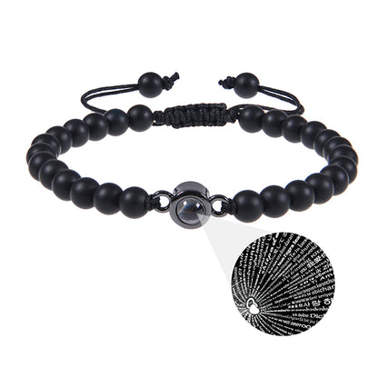 White turquoise custom photo projection bracelet by BackupMyFilesNow.com featuring engraved text in 100 languages.