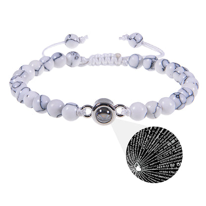 White turquoise Custom Photo Projection Bracelet by BackupMyFilesNow.com with engraved text in 100 languages.