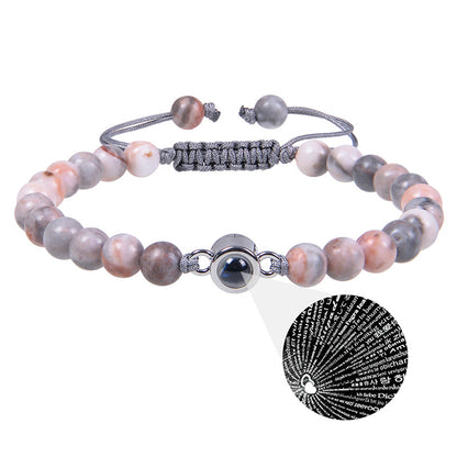 White turquoise Custom Photo Projection Bracelet by BackupMyFilesNow.com featuring engraved text in 100 languages.