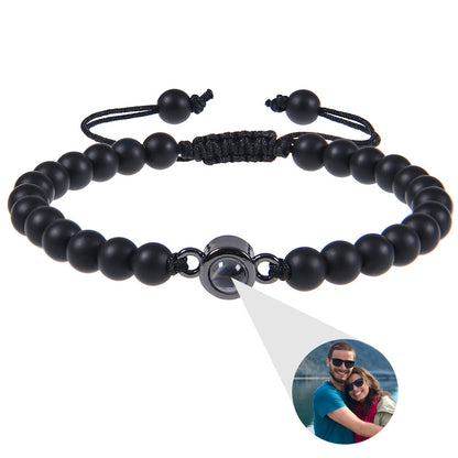 White turquoise custom photo projection bracelet from BackupMyFilesNow.com featuring engraved text in 100 languages.