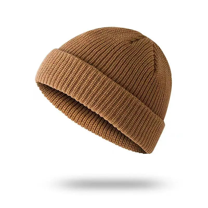 Yellow solid knit beanie cap for men and women, warm and stylish wool skullies for autumn and winter fashion.