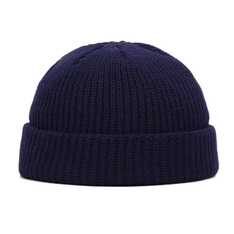 Yellow solid wool beanie cap with a simple, warm knitted design for men and women, suited for autumn and winter fashion.