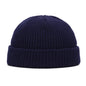 Yellow solid wool beanie cap with a simple, warm knitted design for men and women, suited for autumn and winter fashion.