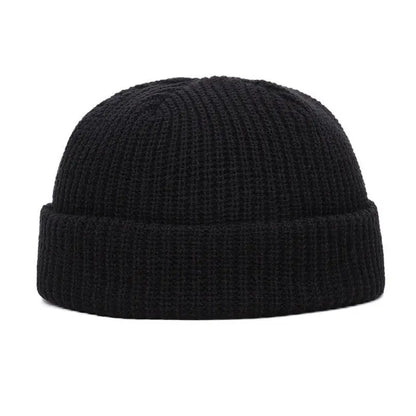 Yellow knitted beanie cap for men and women, warm and stylish solid wool skullie hat for autumn and winter fashion.
