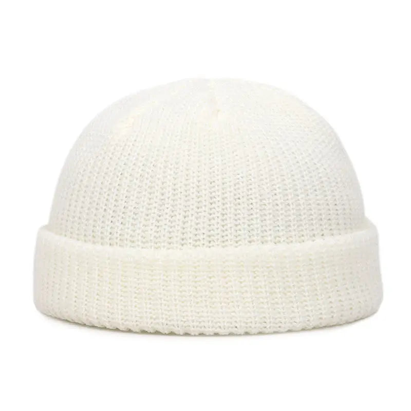 Yellow knit beanie cap for men and women, warm and stylish solid wool skullies for autumn and winter fashion.