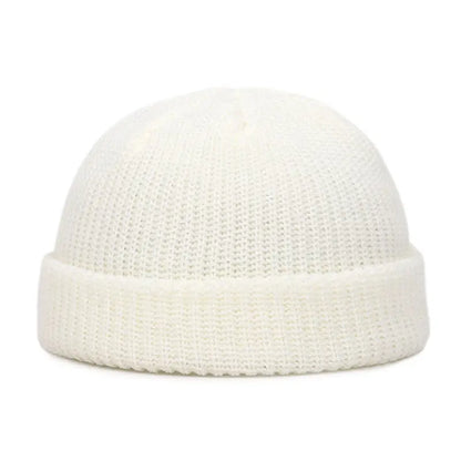 Yellow knit beanie cap for men and women, warm and stylish solid wool skullies for autumn and winter fashion.