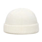 Yellow knit beanie cap for men and women, warm and stylish solid wool skullies for autumn and winter fashion.