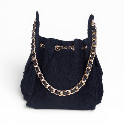 Small black Bayshore Bucket by BEACH HAUS, showing the stylish, compact beach tote with sturdy handles and sleek design.