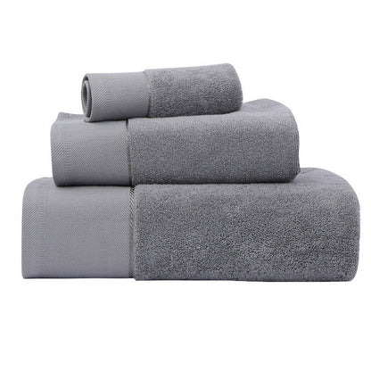 Three-piece cotton bath towel set with soft, water-absorbing fabric in assorted colors
