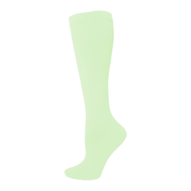 Women's calf-length compression socks in black with a snug, supportive fit