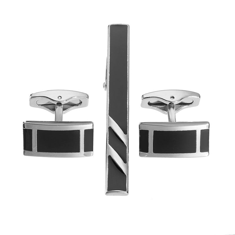 Black enamel silver diagonal stripes tie clip and cuff buckle set; close-up view of the matching accessories