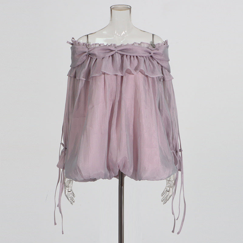 Retro off-the-shoulder chiffon top with strap details and flowing bell sleeves in a solid color