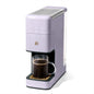 Beautiful Perfect Grind™ single serve coffee maker in sage green by Drew Barrymore, with programmable features and sleek design.