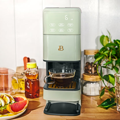 Beautiful Perfect Grind™ programmable single serve coffee maker in sage green by Drew Barrymore, with digital controls and compact design.