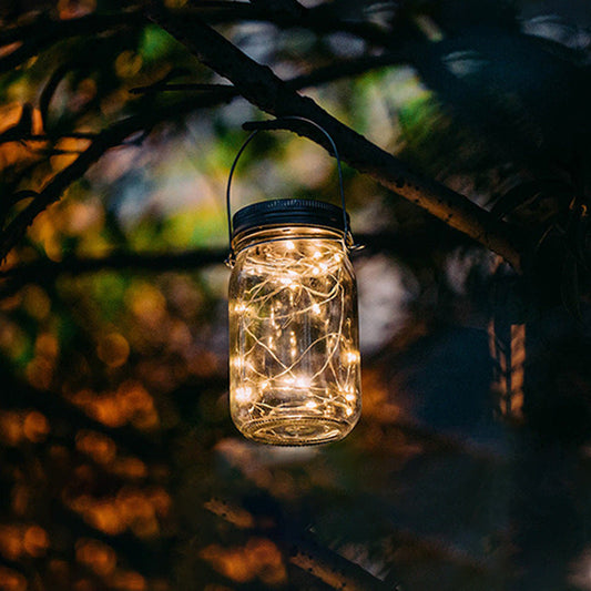 Solar Mason Jar Light outdoor hanging decoration with string lights, shown in a glass jar