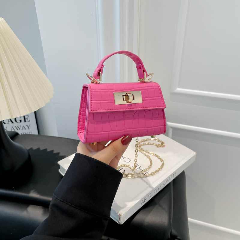 Casual small square handbag with shoulder strap in a compact, versatile design