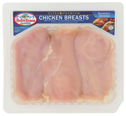 Boneless skinless chicken breasts from Bell & Evans displayed on a cutting board, ready for cooking or meal prep.
