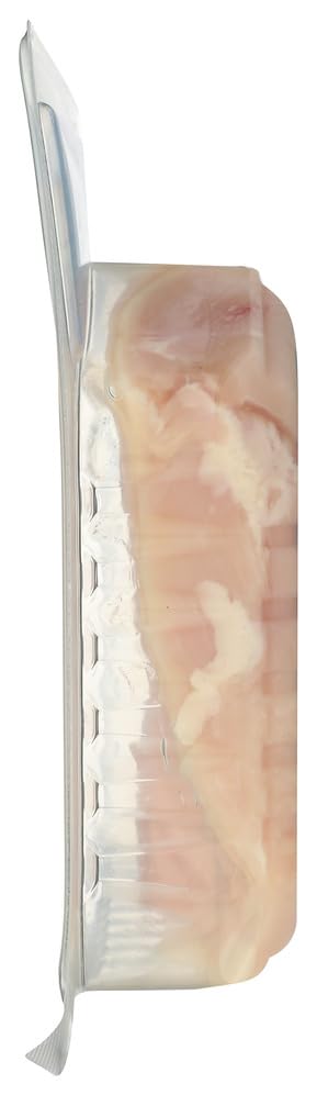 Bell & Evans boneless skinless chicken breasts on a cutting board, fresh and ready for cooking