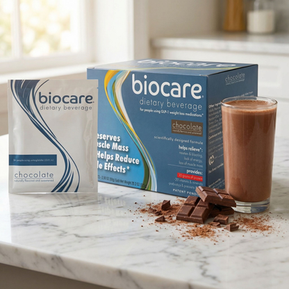 A 30g chocolate protein dietary beverage by Biocare, showing the product packaging with a glass of prepared chocolate drink.