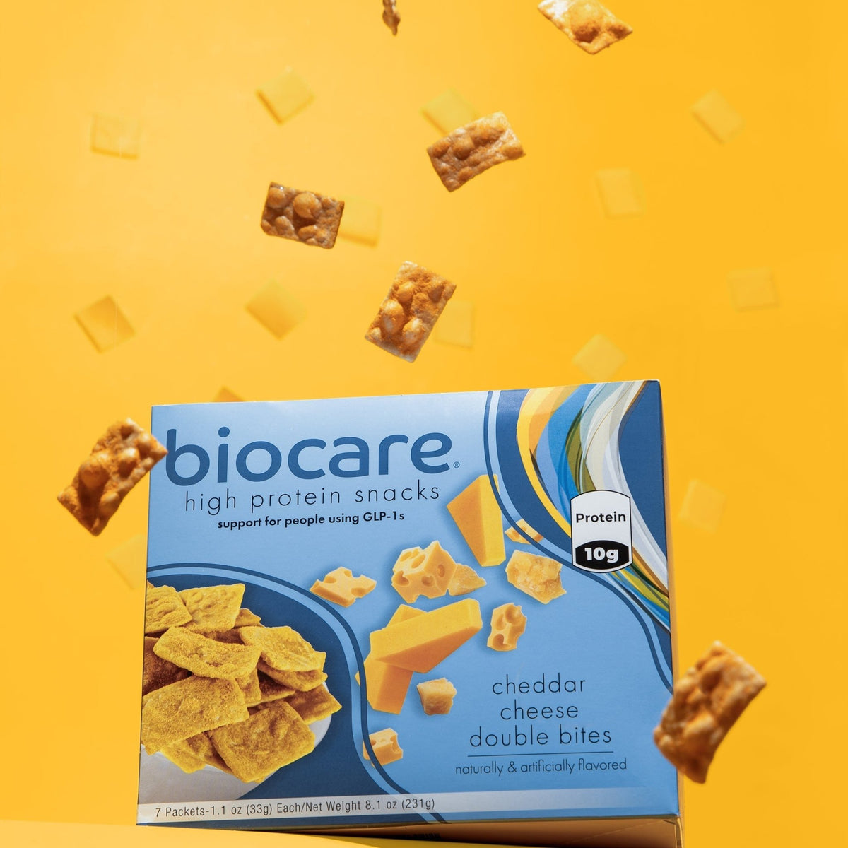 Biocare High Protein Cheddar Cheese Double Bites, close-up of golden cheese bites with textured cheddar coating.