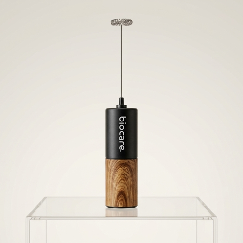 Biocare electric frother with stainless steel wand and black handle for creamy milk froth and hot beverages.