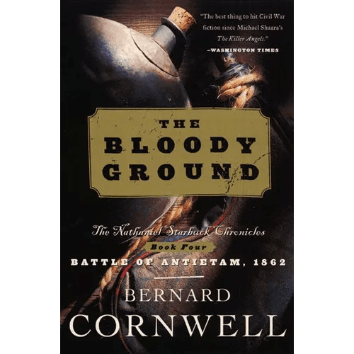 Paperback of Bloody Ground: The Nathaniel Starbuck Chronicles Book Four by Books by splitShops, featuring a cover with dark, intense imagery.