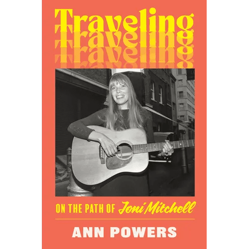 Hardcover book titled "Traveling: On the Path of Joni Mitchell" by splitShops, featuring a cover image with artistic design.