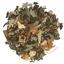 Loose leaf herbal tea called Breathe Well by Novel Tea Book Shop, showcasing fresh, dried tea leaves in a natural setting.