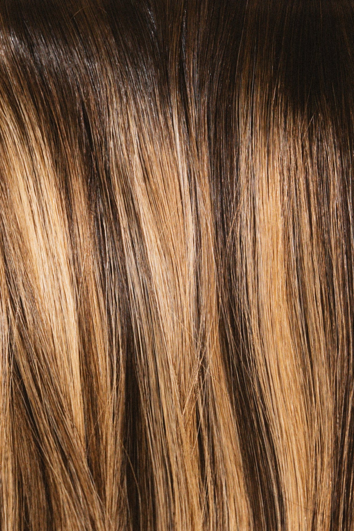 Brondebabe with Rachel Paige XO Luxury Signature Weft Collection hair extensions in a natural blonde and brunette blend.