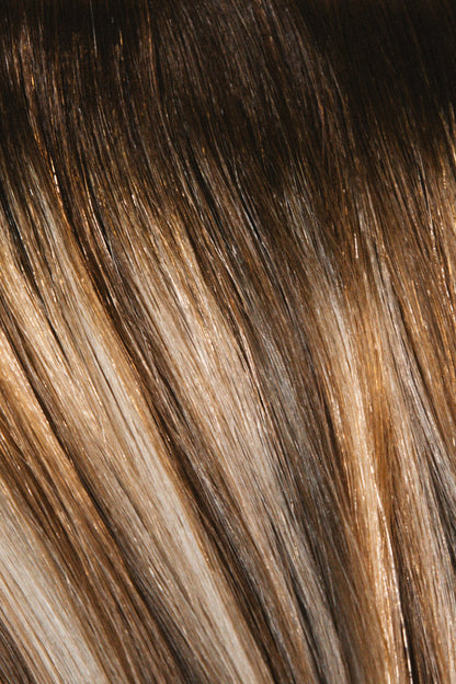 Close-up of Rachel Paige XO Luxury Signature Weft Collection hair extensions, showing their smooth, high-quality texture and natural color.