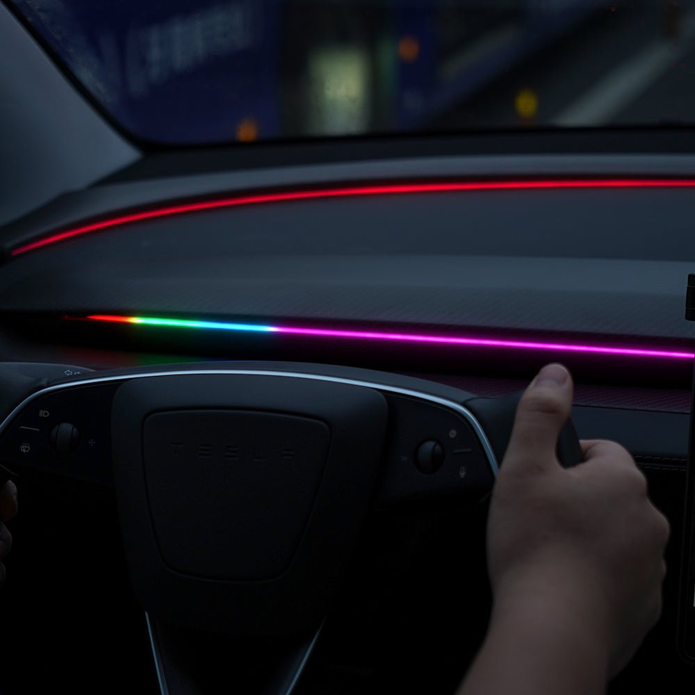 TESERY NeuroLight RGB ambient lighting for Model 3/Y with integrated BSD system, visible on dashboard with customizable colors.
