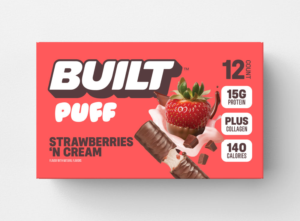Built Strawberries 'N Cream Puff bar with creamy filling and fresh strawberry flavor, displayed on a white background.