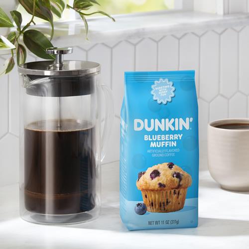 ByBies Dunkin Blueberry Muffin flavored ground coffee in an 11-ounce package, featuring a vibrant label and coffee beans.