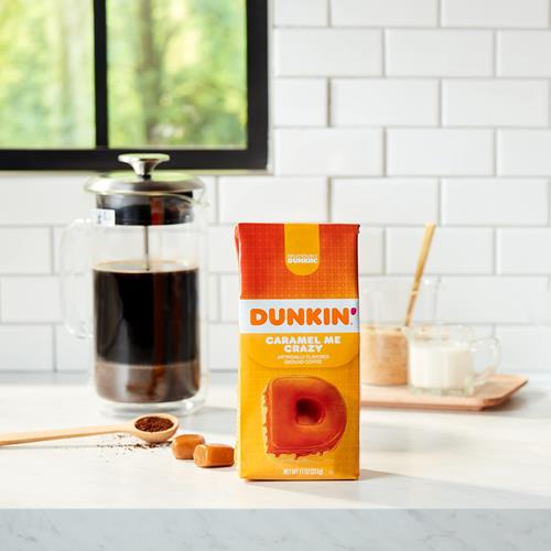 Ground coffee by ByBies, Dunkin Caramel Me Crazy flavored coffee in an 11-ounce pack, with the coffee grounds visible in the image.