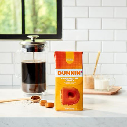 Ground coffee by ByBies, Dunkin Caramel Me Crazy flavored coffee in an 11-ounce pack, with the coffee grounds visible in the image.