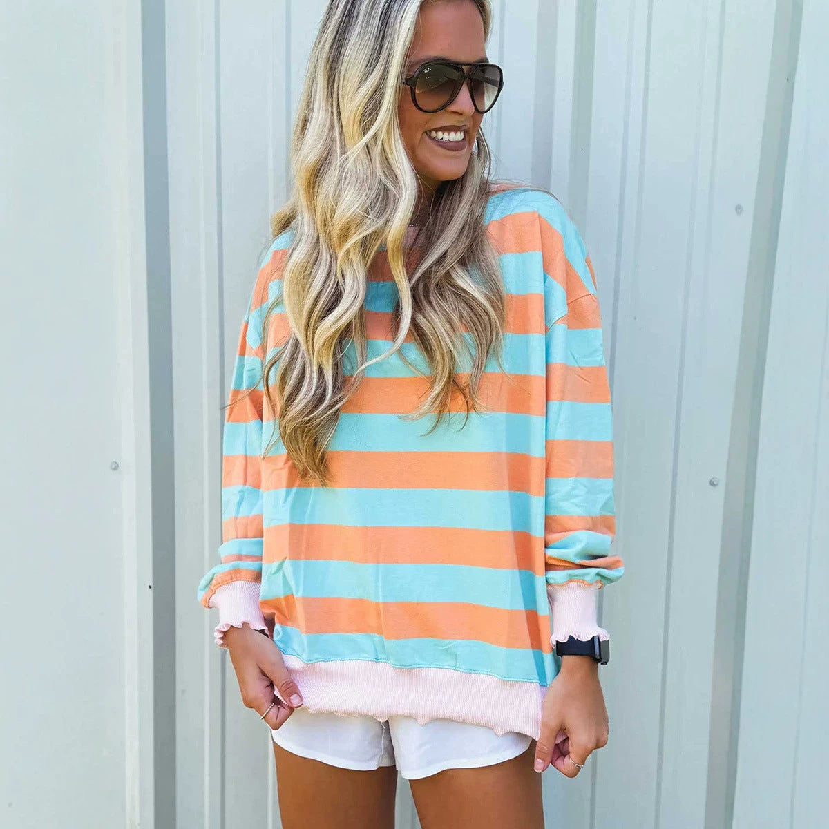 Relaxed-fit striped colorblock crewneck sweatshirt in a minimalist pullover design