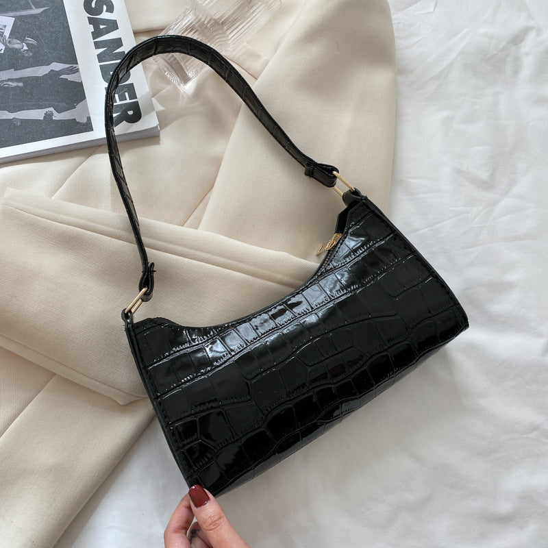 Women's small shoulder and underarm bag by BACKUPMYFILESNOW® with a sleek design and compact size, shown in the image.