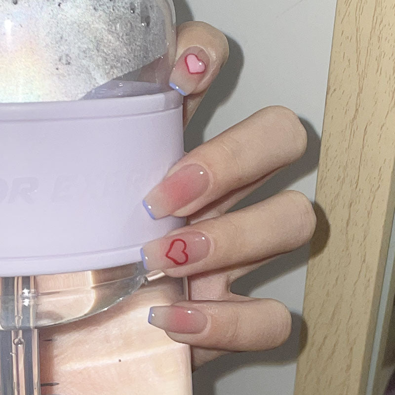 Blue graffiti pattern wearable fake nails by Ashionable, set displayed from multiple angles