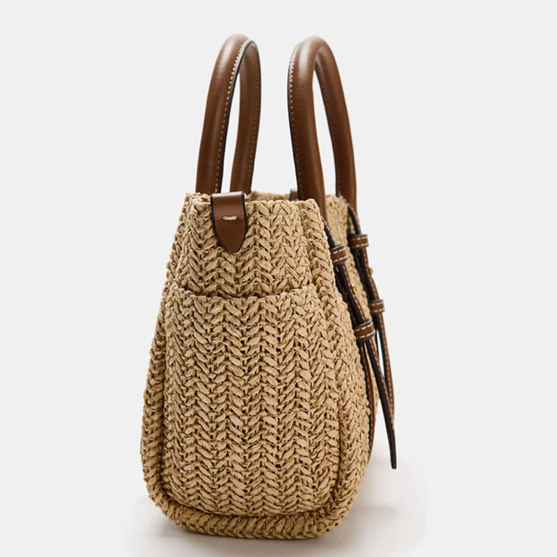 Straw woven hand-held shoulder crossbody bag with textured natural weave and compact structured design