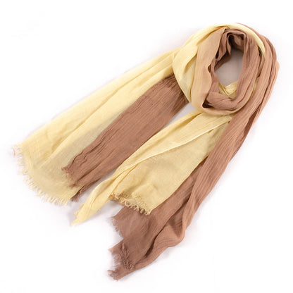 Large soft warm cotton scarf with tassel edges folded on display