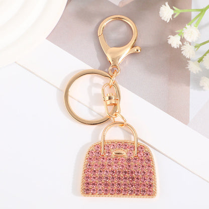 Minimalist diamond-studded handbag charm keychain in a creative design