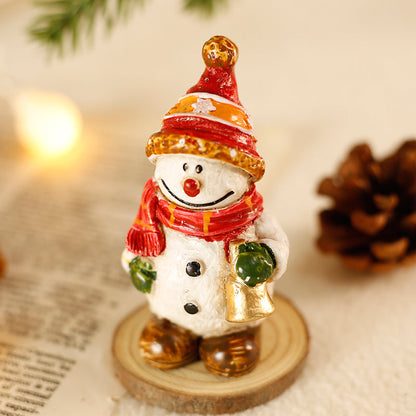 Desktop Christmas decorations and mini ornaments arranged for a festive tabletop display