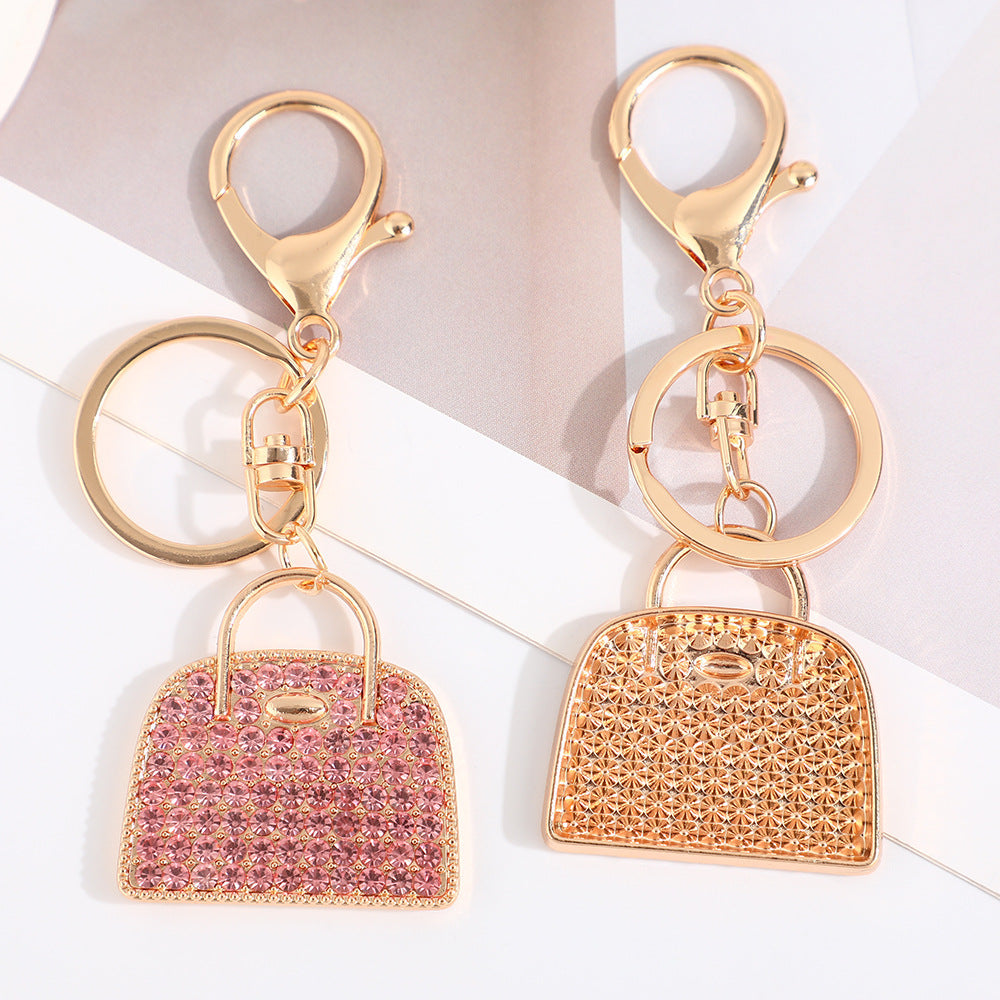 Creative minimalist diamond-studded handbag charm keychain in a compact decorative design