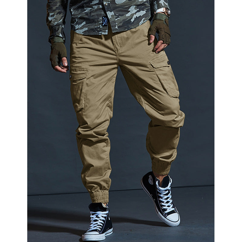 Men's slim-fit multi-pocket work trousers in durable fabric, showing front pockets and structured leg design