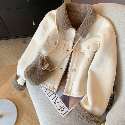 Women's loose thick small fur coat in plush texture, front view