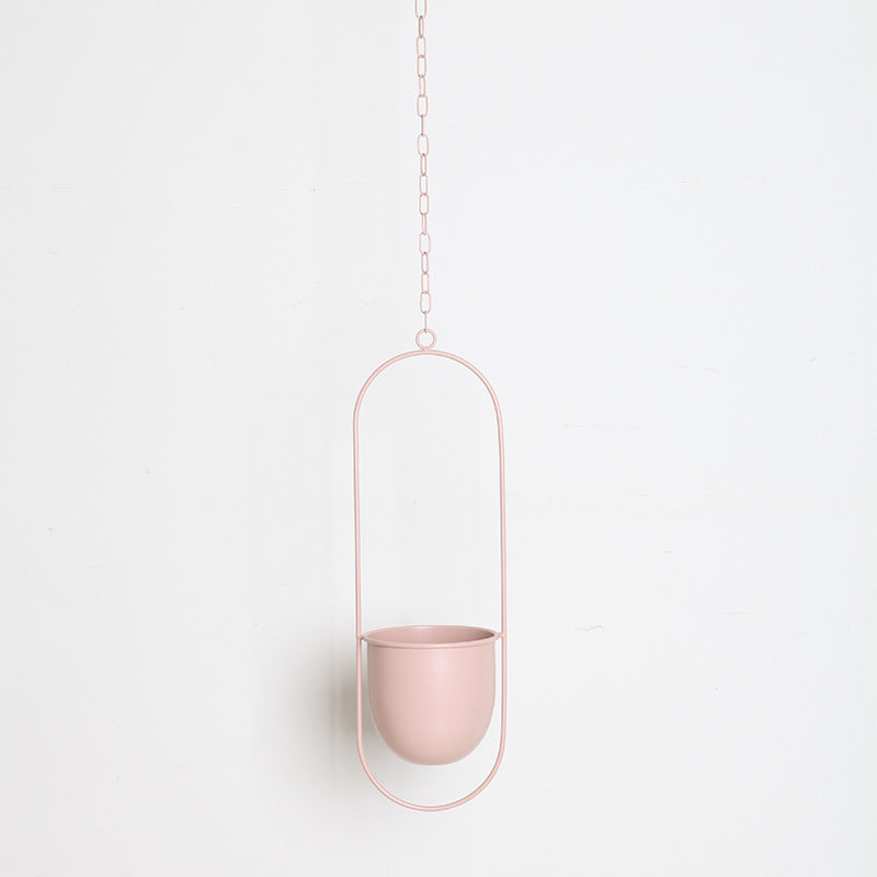 Nordic-style hanging iron flower pot with hydroponic orchid plant decoration in a simple light luxury design