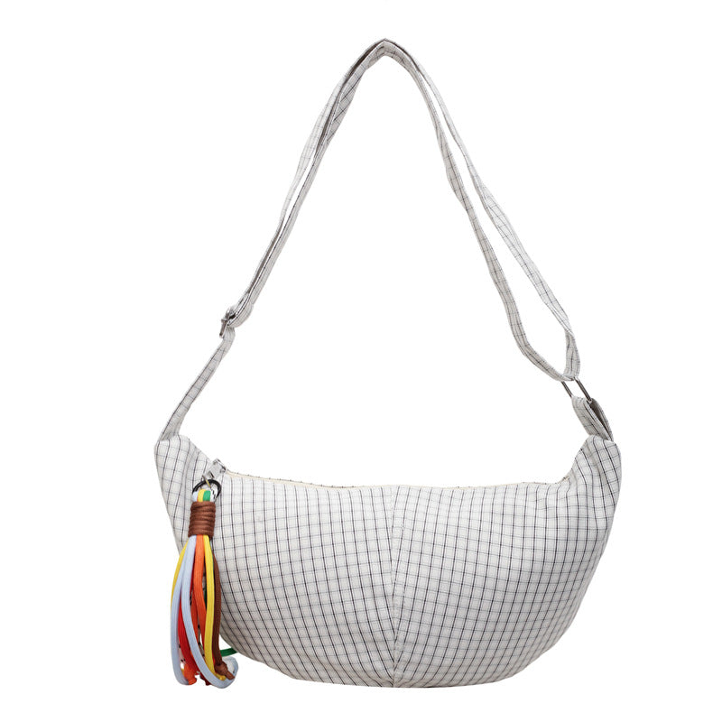 Large-capacity casual niche-style crossbody bag for students, spacious everyday shoulder bag in close-up view
