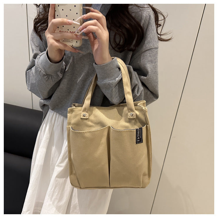 Plain-colored student lunch box tote bag with simple design and spacious interior