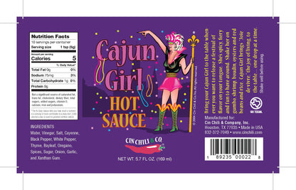 Cajun Girl Louisiana-Style Hot Sauce bottle from Cinderosa Ranch with bright label and spicy hot sauce inside.